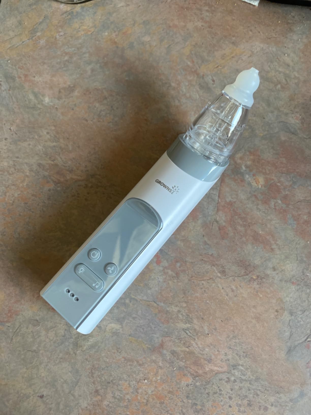 Grownsy nasal aspirator case showing parts and warning card